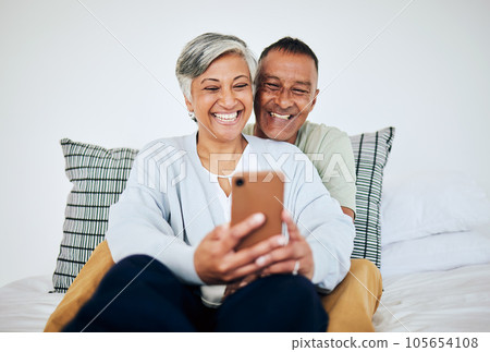 Mature, couple and selfie in bed at home with smile, retirement love and happy marriage. House, mobile and social media for profile picture in bedroom relax and online together and photo on web Mature, couple and selfie in bed at home with smile, retirement love and happy marriage. House, mobile and social media for profile picture in bedroom relax and online together and photo on web 105654108