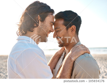 Love, hug and gay men on beach, romance and smile on summer vacation together in Thailand. Sun, ocean and island, happy lgbt couple embrace in nature on fun tropical holiday with pride, sea and sand. 105654176