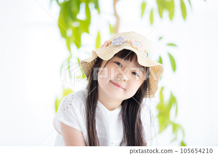 Portrait of a girl A girl wearing a straw hat 105654210