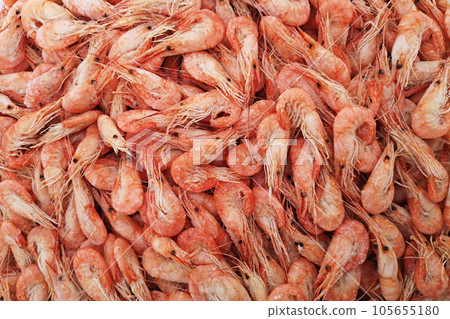 Shrimps. The fish market. Shrimps background texture. A lot of sea shrimp 105655180