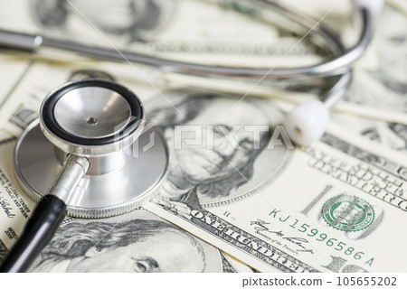 Stethoscope on the dollars. Medical costs. Healthcare payment concept Stethoscope on the dollars. Medical costs. Healthcare payment concept 105655202