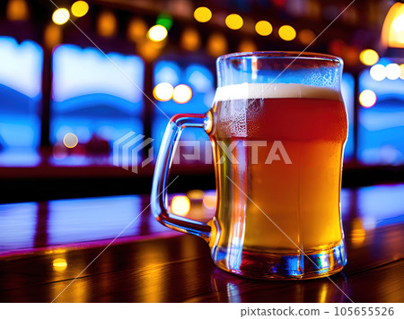 glass of beer on the table in the bar. blur background with bokeh glass of beer on the table in the bar. blur background with bokeh 105655526