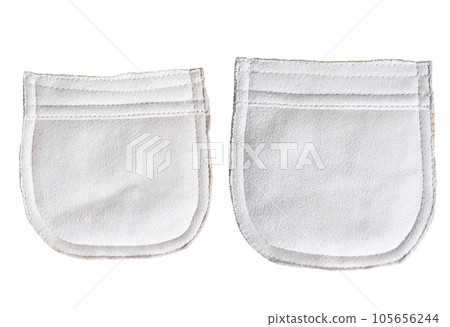 Two suede pockets of ivory color. Can be used for scrapbooking design, decoration. Isolated on white background. Set of suede leather pocket of light beige color 105656244