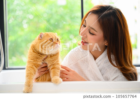 A senior with her daughter is depicted in a happy portrait at their home A senior with her daughter is depicted in a happy portrait at their home 105657764