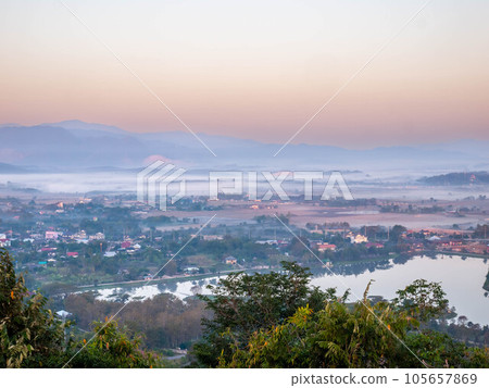 Natural viewpoint, mountains, hills, forests and river under morning mist 105657869