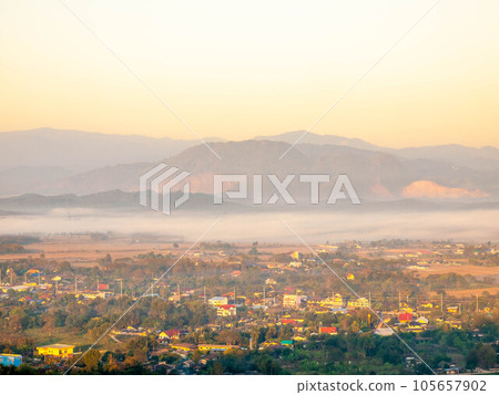 Natural viewpoint, mountains, hills, forests and river under morning mist Natural viewpoint, mountains, hills, forests and river under morning mist 105657902