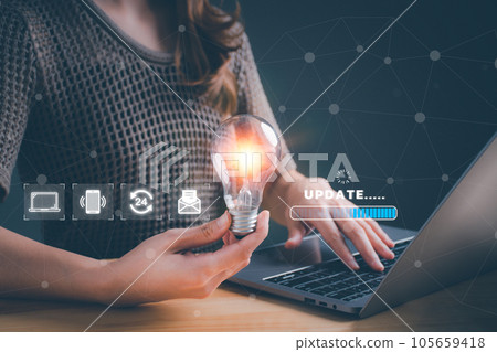 Woman holding light bulb and update software computer. Program upgrade business technology internet on virtual screen. loading bar with installing the update. Internet and technology concept. 105659418