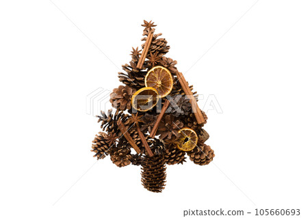 Isolated Christmas tree made from natural cones on colored background, view from above. New Year minimal concept with copy space Isolated Christmas tree made from natural cones on colored background, view from above. New Year minimal concept with copy space 105660693