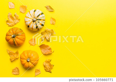 Autumn composition. Pattern made of dried leaves and other design accessories on table. Flat lay, top view 105660771