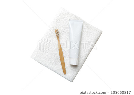 toothpaste and toothbrush top view with copy space isolated on white background. Flat lay. Dental hygiene. Oral care products on light background. Body care concept 105660817