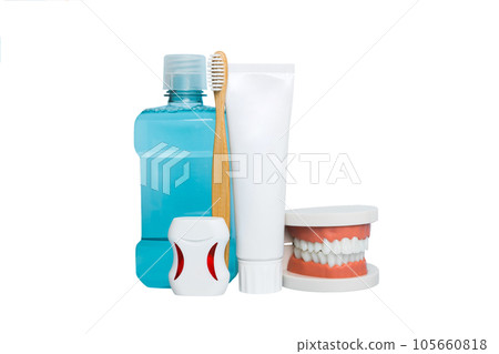 Mouthwash and other oral hygiene products on colored table top view with copy space. Flat lay. Dental hygiene. Oral care kit. Dentist concept 105660818