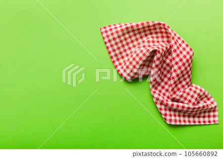 top view with red empty kitchen napkin isolated on table background. Folded cloth for mockup with copy space, Flat lay. Minimal style top view with red empty kitchen napkin isolated on table background. Folded cloth for mockup with copy space, Flat lay. Minimal style 105660892