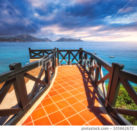 Beautiful view from balcony on blue sea, mountains and cloudy sky 105662672
