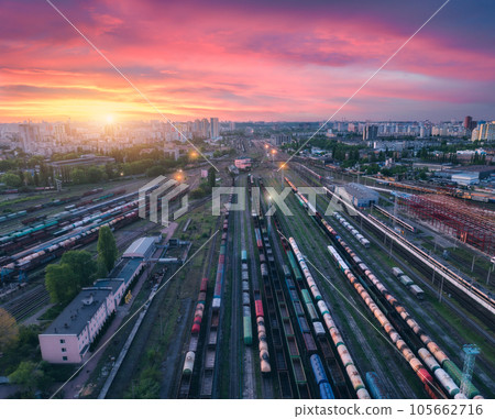 Aerial view of freight trains at colorful sunset. Railway station 105662716