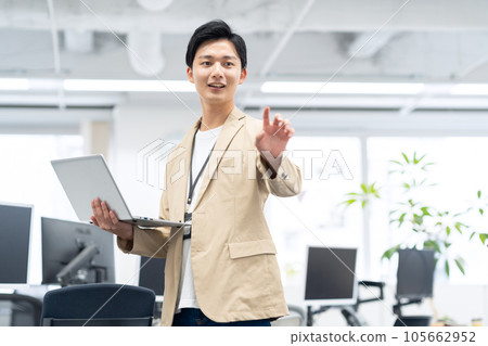 Young engineer working in the office with a computer Young engineer working in the office with a computer 105662952