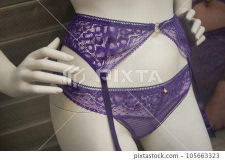 Closeup of purple suspended belt bra on mannequin in a fashion store showroom Closeup of purple suspended belt bra on mannequin in a fashion store showroom 105663323