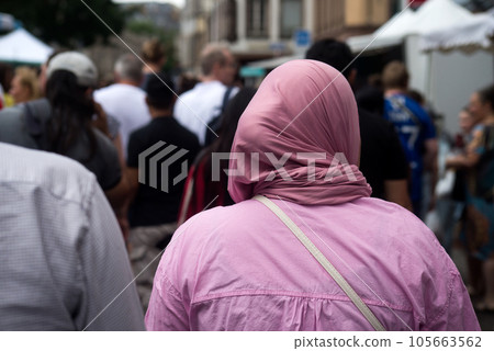 Portrait on back view of Veiled Muslim woman walking in the street 105663562