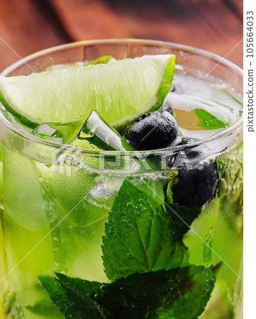 glass of fresh Mojito on wooden glass of fresh Mojito on wooden 105664033