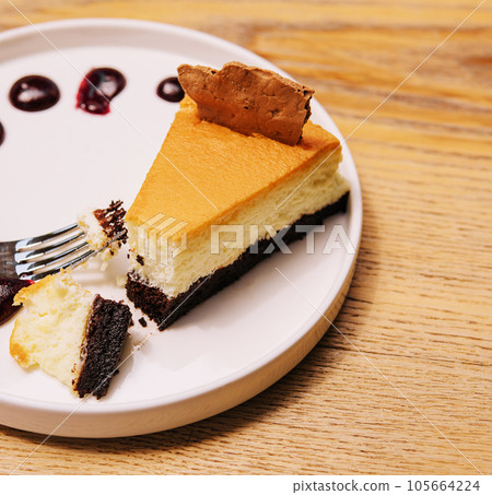 Cheesecake with berry jam on plate Cheesecake with berry jam on plate 105664224