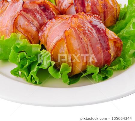twisted rolls with bacon on white plate twisted rolls with bacon on white plate 105664344