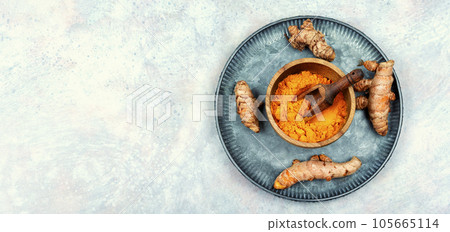 Turmeric root and turmeric powder, copy space. 105665114