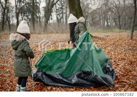 Beautiful little black girls in tent camping in the forest. Beautiful little black girls in tent camping in the forest. 105667182