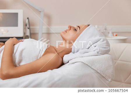 beautiful woman at spa salon. female face with healthy skin 105667504