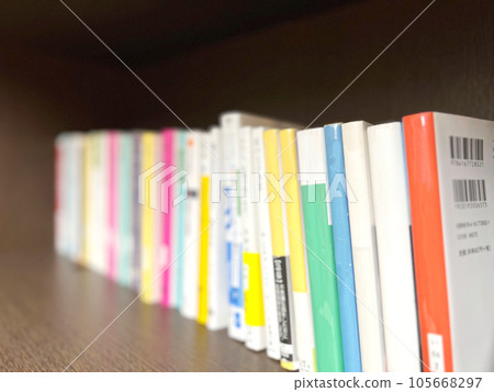 Many paperback books lined up on the shelf Many paperback books lined up on the shelf 105668297