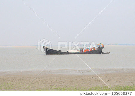 wooden fishing boat on sea 105668377