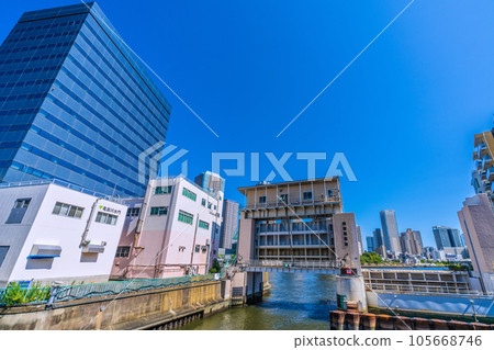 Cityscape of Tokyo, Japan View of the Kameshima River Floodgate from Minami Takahashi (to the far left of the floodgate is the direction of Okawabata River City 21) Cityscape of Tokyo, Japan View of the Kameshima River Floodgate from Minami Takahashi (to the far left of the floodgate is the direction of Okawabata River City 21) 105668746