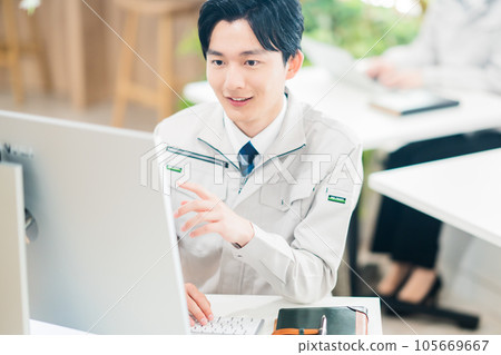 Young male engineer heading to a personal computer 105669667