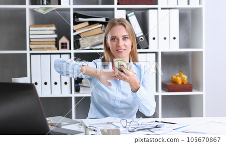 Beautiful businesswoman portrait. Scattering money Beautiful businesswoman portrait. Scattering money 105670867