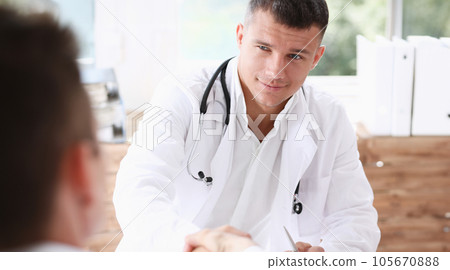 Doctor shake hand as hello with patient Doctor shake hand as hello with patient 105670888