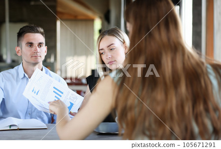 A group of people attending a seminar 105671291