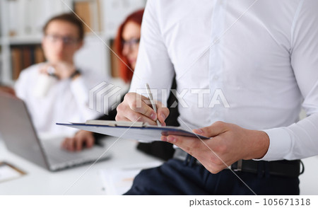 Male hand holding silver pen ready 105671318