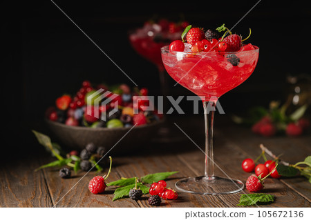 Glass of berry cocktail 105672136