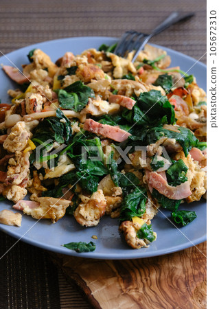 plate of omelet with spinach 105672310