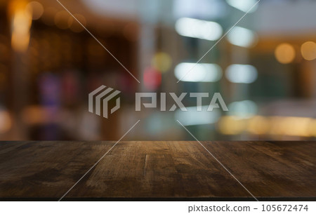 Empty wood table top and blur of out door garden background Empty wooden table space for text marketing promotion. blank wood table copy space for background Empty wood table top and blur of out door garden background Empty wooden table space for text marketing promotion. blank wood table copy space for background 105672474