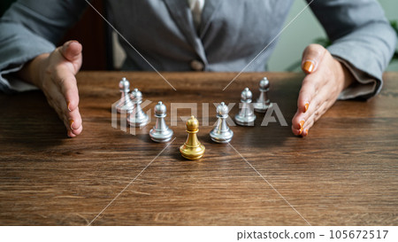 Chess leader and team. Human resources concept career management with clasped hands planning strategy with chess figures. leadership or success teamwork. Inspiration idea of goal 105672517