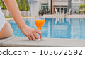 Summer holiday Young asian Beautiful woman relaxing in swimming pool at spa resort. Beautiful tropical beach front hotel resort with swimming pool 105672592