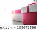Valentine present. Gift box and red ribbon for romantic couple.Gift box and ribbon with tag for valentine present 105672596
