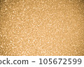 Gold glitters background. shimmering blur spot lights Bokeh Shiny gold light background. 105672599