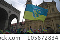 Munich. Germany. Odeonsplatz muenchen. Subject of war between Russia and Ukraine. Protesters holding yellow and blue and European Union flags at demonstration against war in Bayern 105672834