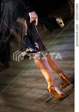 Legs of young dancers on the dance floor Legs of young dancers on the dance floor 105673360