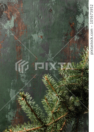 Top view of green wooden background with Christmas fir tree, cozy xmas flat lay Top view of green wooden background with Christmas fir tree, cozy xmas flat lay 105673952