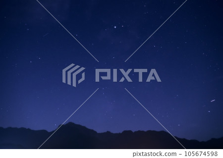 Hakushu Town, Hokuto City, blue night sky, Altair shining above Mt. Kaikomagatake in the Southern Alps Hakushu Town, Hokuto City, blue night sky, Altair shining above Mt. Kaikomagatake in the Southern Alps 105674598
