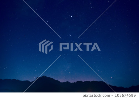 Hakushu Town, Hokuto City, blue night sky, Altair shining above Mt. Kaikomagatake in the Southern Alps Hakushu Town, Hokuto City, blue night sky, Altair shining above Mt. Kaikomagatake in the Southern Alps 105674599