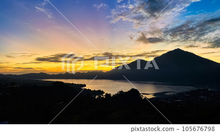 Stunning view on mount Abang and lake Batur at sunrise Stunning view on mount Abang and lake Batur at sunrise 105676798