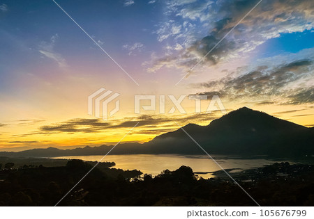 Stunning view on mount Abang and lake Batur at sunrise Stunning view on mount Abang and lake Batur at sunrise 105676799