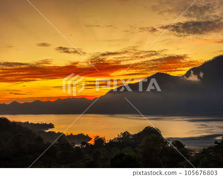 Stunning view on mount Abang and lake Batur at sunrise Stunning view on mount Abang and lake Batur at sunrise 105676803